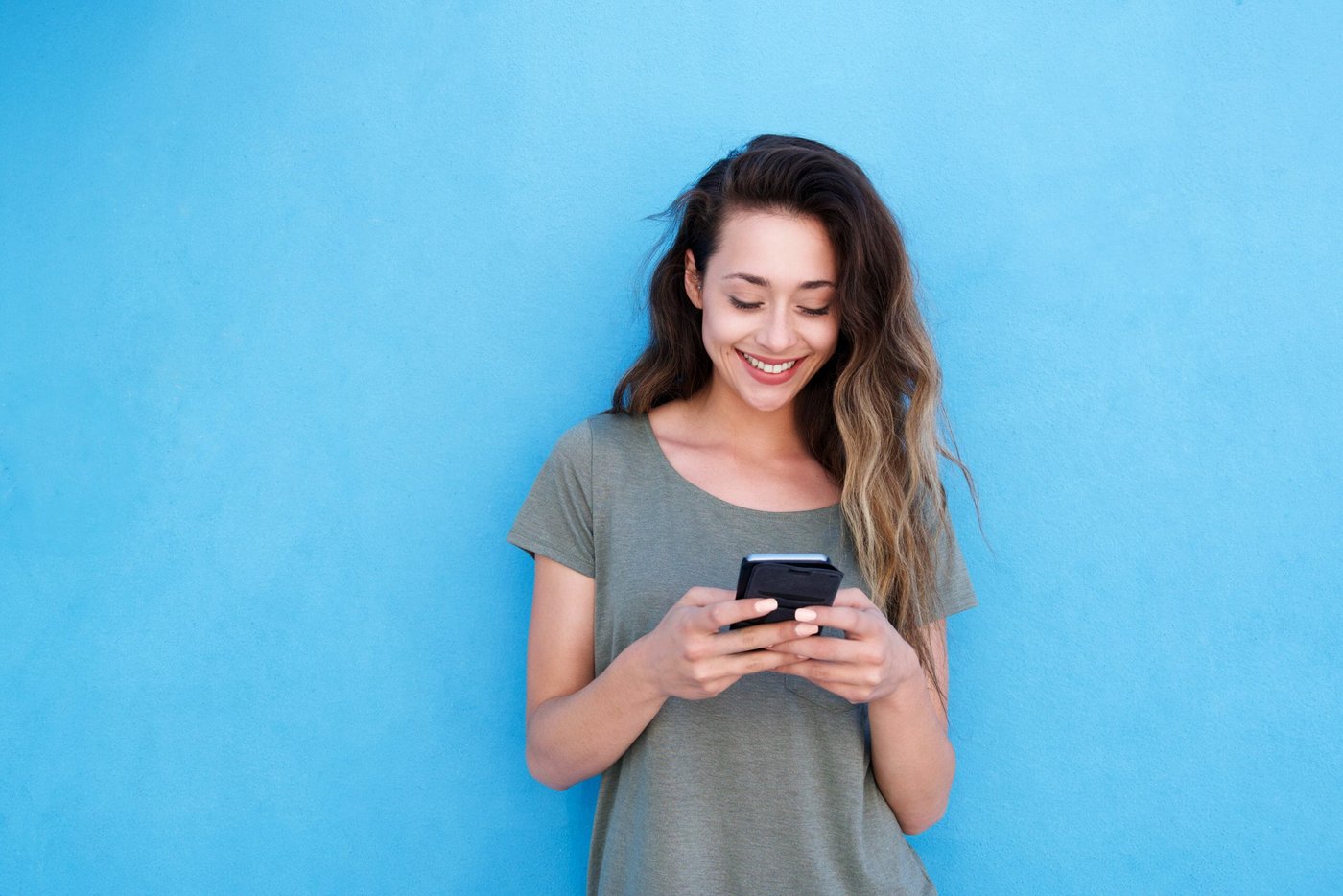 Immigrant woman using a U.S. citizenship test app.