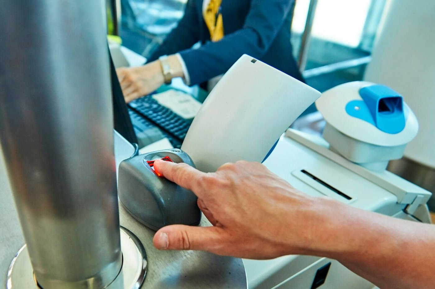 Immigrant has their biometrics taken by USCIS