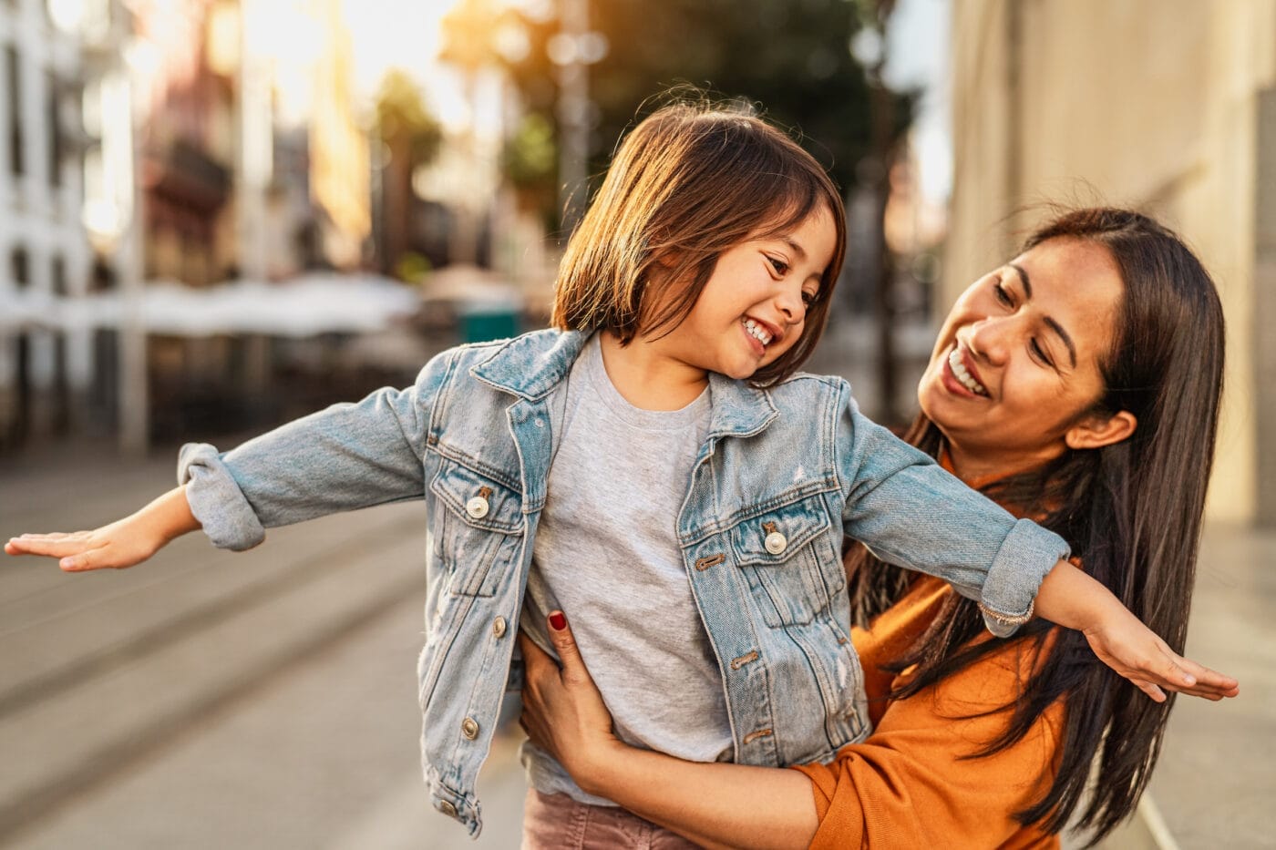 Filipino dual U.S. citizen outside her house with her daughter