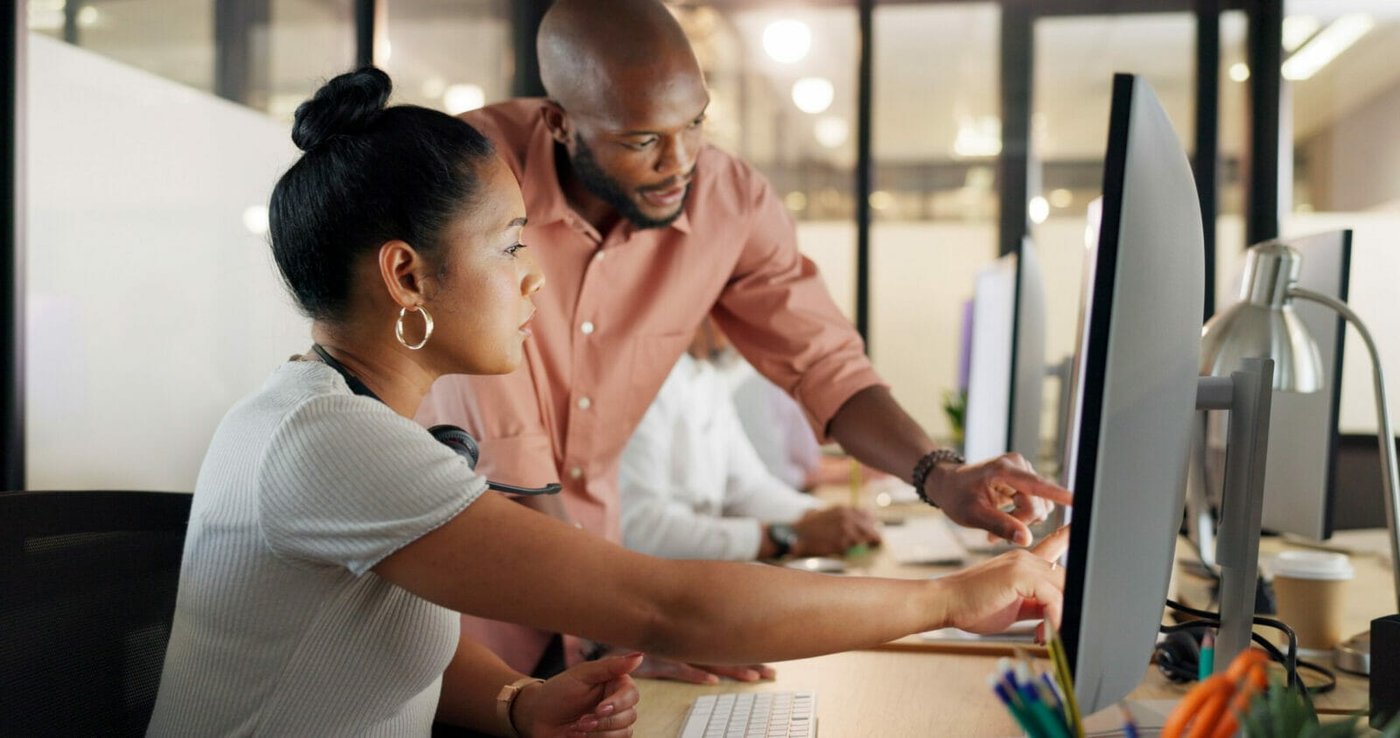 Collaboration, human resources and training with a business black woman talking to her manager or supervisor at work. Teamwork, meeting and management with a man and female employee in the office An HR person talking with an H-1B employee.