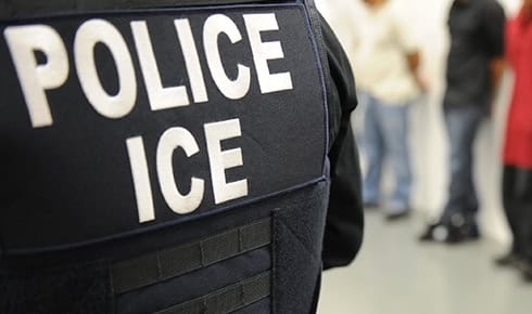 ICE officer overseeing an immigration enforcement operation.