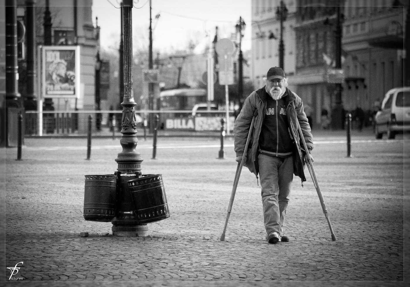 Old man walking on crutches