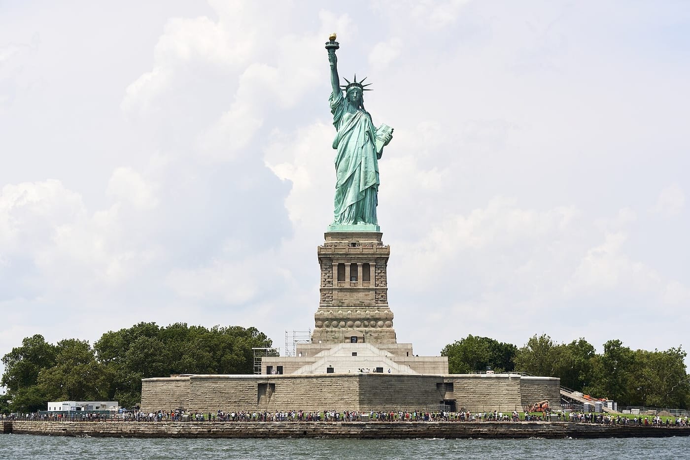 Statue of Liberty on a cloudy day representing the history of U.S. immigration